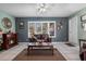 Cozy living area with fireplace, leather seating, and large windows at 8134 Hook Cir, Orlando, FL 32836