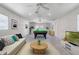 Bright room featuring a billiards table, modern sofa, and large windows at 8134 Hook Cir, Orlando, FL 32836