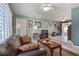 Spacious living room with leather furniture and built-in shelving at 8134 Hook Cir, Orlando, FL 32836