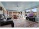 Bright sunroom featuring comfy seating and large windows at 8134 Hook Cir, Orlando, FL 32836