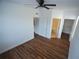 Main bedroom with wood-look floors, ceiling fan, and walk-in closet at 8225 Claire Ann Dr # 206, Orlando, FL 32825