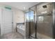 Bathroom with soaking tub, walk-in shower, and large window showcasing a view at 8729 Eden Cove Dr, Winter Garden, FL 34787
