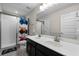 ' bathroom with double sinks, shower, and race car theme at 8729 Eden Cove Dr, Winter Garden, FL 34787