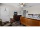 Bedroom with full-size bed, ceiling fan, and dark-wood dresser at 8729 Eden Cove Dr, Winter Garden, FL 34787