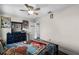 Bedroom with twin-size bed, ceiling fan and dresser with Toy Story decor at 8729 Eden Cove Dr, Winter Garden, FL 34787