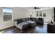 Spacious bonus room featuring an L-shaped sectional sofa and large windows at 8729 Eden Cove Dr, Winter Garden, FL 34787