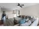 Bright bonus room with sectional sofa and ceiling fan at 8729 Eden Cove Dr, Winter Garden, FL 34787