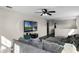 Bonus room with sectional sofa, TV, and plenty of natural light at 8729 Eden Cove Dr, Winter Garden, FL 34787