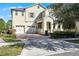 Two-story house with attached garage and manicured landscaping at 8729 Eden Cove Dr, Winter Garden, FL 34787