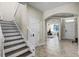 Bright foyer with tile flooring and views to the stairs and office at 8729 Eden Cove Dr, Winter Garden, FL 34787