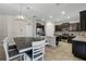 Modern kitchen with dark cabinetry, stainless steel appliances, and an island at 8729 Eden Cove Dr, Winter Garden, FL 34787