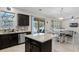 Open kitchen boasts granite countertops and stainless steel appliances at 8729 Eden Cove Dr, Winter Garden, FL 34787