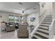 Spacious living room with comfortable seating and staircase at 8729 Eden Cove Dr, Winter Garden, FL 34787