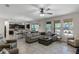 Spacious living room with large sectional sofa and tile flooring at 8729 Eden Cove Dr, Winter Garden, FL 34787