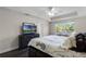 Spacious main bedroom with king-size bed and large windows at 8729 Eden Cove Dr, Winter Garden, FL 34787
