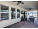 Covered patio with seating area, outdoor TV, and pool view at 8729 Eden Cove Dr, Winter Garden, FL 34787