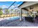 Relaxing pool and patio area with seating and screened enclosure at 8729 Eden Cove Dr, Winter Garden, FL 34787