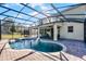 Inviting pool area with screened enclosure and patio furniture at 8729 Eden Cove Dr, Winter Garden, FL 34787