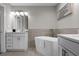 Bathroom featuring a freestanding bathtub and modern double vanity at 8774 Worldquest Blvd, Orlando, FL 32821