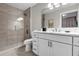 Bathroom with shower, white vanity and marble countertop at 8774 Worldquest Blvd, Orlando, FL 32821