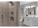 Modern bathroom with walk-in shower, vanity, and toilet at 8774 Worldquest Blvd, Orlando, FL 32821