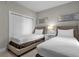 Bedroom with two twin beds and a closet at 8774 Worldquest Blvd, Orlando, FL 32821