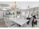 Open concept dining area with kitchen and living room views at 8774 Worldquest Blvd, Orlando, FL 32821