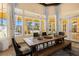 Community clubhouse dining area with large table and windows at 8774 Worldquest Blvd, Orlando, FL 32821