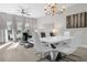 Modern dining area with white table and chairs at 8774 Worldquest Blvd, Orlando, FL 32821