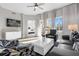 Bright living room with comfortable seating and views to bedroom at 8774 Worldquest Blvd, Orlando, FL 32821