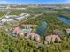Aerial view of resort community with pool, lake, and lush landscaping at 8801 Worldquest Blvd, Orlando, FL 32821