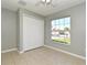 Spacious bedroom featuring tile floors and a large window at 997 Gascony Ct, Kissimmee, FL 34759