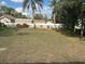 Backyard featuring a large lawn and mature trees at 102 Colomba Rd, Debary, FL 32713