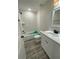 Clean bathroom, white vanity, and a bathtub at 102 Colomba Rd, Debary, FL 32713