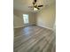 Bright bedroom featuring LVP flooring and a window at 102 Colomba Rd, Debary, FL 32713