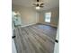 Spacious bedroom with ceiling fan and LVP flooring at 102 Colomba Rd, Debary, FL 32713