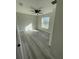 Bright bedroom with ceiling fan and grey vinyl plank flooring at 102 Colomba Rd, Debary, FL 32713