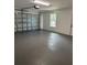 Spacious garage with an automatic door and a bright window at 102 Colomba Rd, Debary, FL 32713