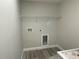 Laundry room with vinyl flooring and overhead shelving at 102 Colomba Rd, Debary, FL 32713