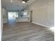 Spacious living area featuring high ceilings and gray vinyl plank flooring at 102 Colomba Rd, Debary, FL 32713