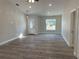 Bright and airy living room with hardwood-look flooring and an open floor plan at 102 Colomba Rd, Debary, FL 32713