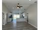 Bright, open-concept living area featuring luxury vinyl floors and high ceilings at 102 Colomba Rd, Debary, FL 32713