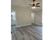 Spacious primary bedroom featuring luxury vinyl floors and an ensuite bathroom at 102 Colomba Rd, Debary, FL 32713