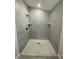 Large walk-in shower with gray tile at 102 Colomba Rd, Debary, FL 32713