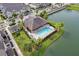 Aerial view of the community pool and clubhouse surrounded by lush landscaping at 1074 Clifton Springs Ln, Winter Springs, FL 32708