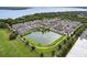 Scenic aerial view of a vibrant residential community with a central pond and fountain at 1074 Clifton Springs Ln, Winter Springs, FL 32708