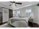 Bedroom features a tray ceiling, a dark-stained barn door, and plantation shutters at 1074 Clifton Springs Ln, Winter Springs, FL 32708