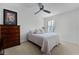 Bedroom featuring a light color scheme, a dresser, and a window with plantation shutters at 1074 Clifton Springs Ln, Winter Springs, FL 32708