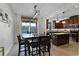 Bright dining area with kitchen views and access to a patio at 1074 Clifton Springs Ln, Winter Springs, FL 32708