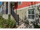 Inviting townhome entrance featuring a well-maintained staircase, lush shrubbery, and a homey feel at 1074 Clifton Springs Ln, Winter Springs, FL 32708